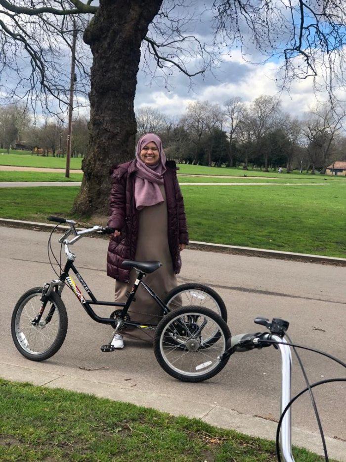 Picture of a women in the park on her bike